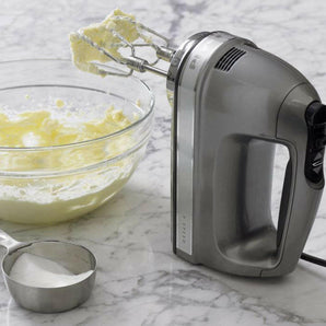 KitchenAid® Silver 9-Speed Contour Hand Mixer.